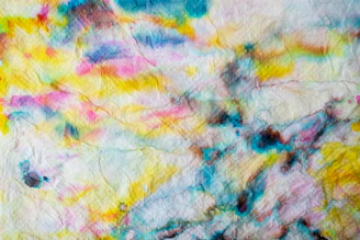 Artistic illustration on textured paper with vibrant colors.