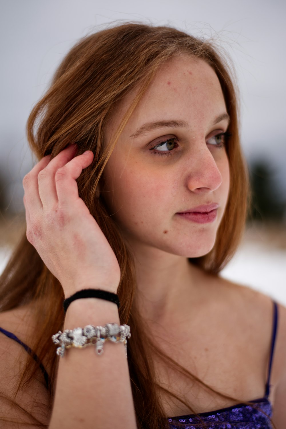 a woman with a bracelet on her wrist