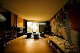 A vibrant, stylish living room featuring a large luxury mural as the focal point.