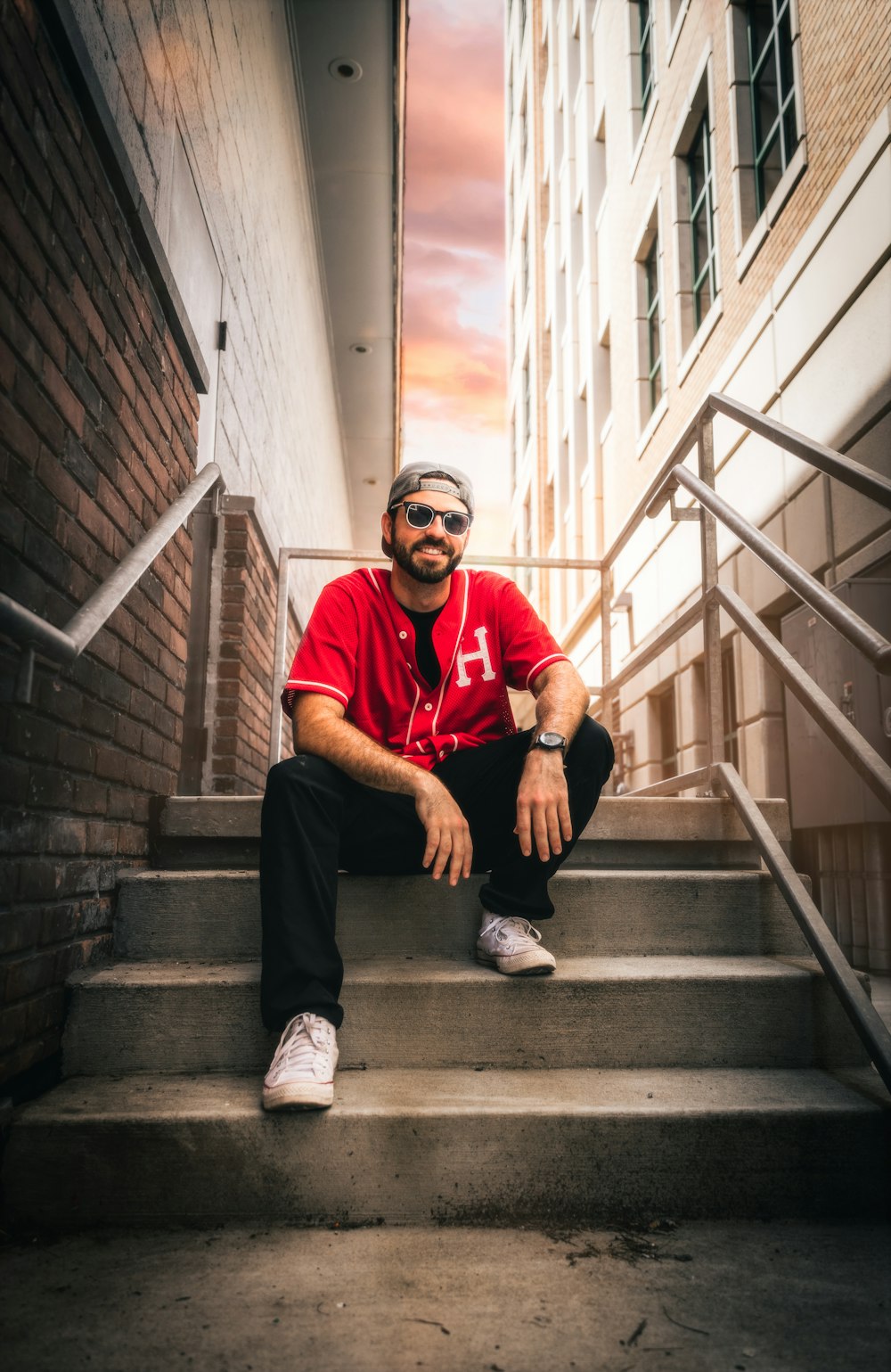 a man sitting on the steps of a building