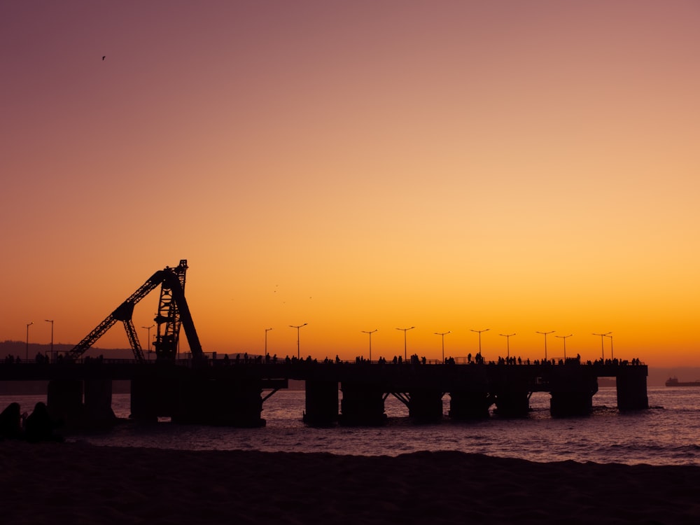 a large crane sitting on top of a bridge