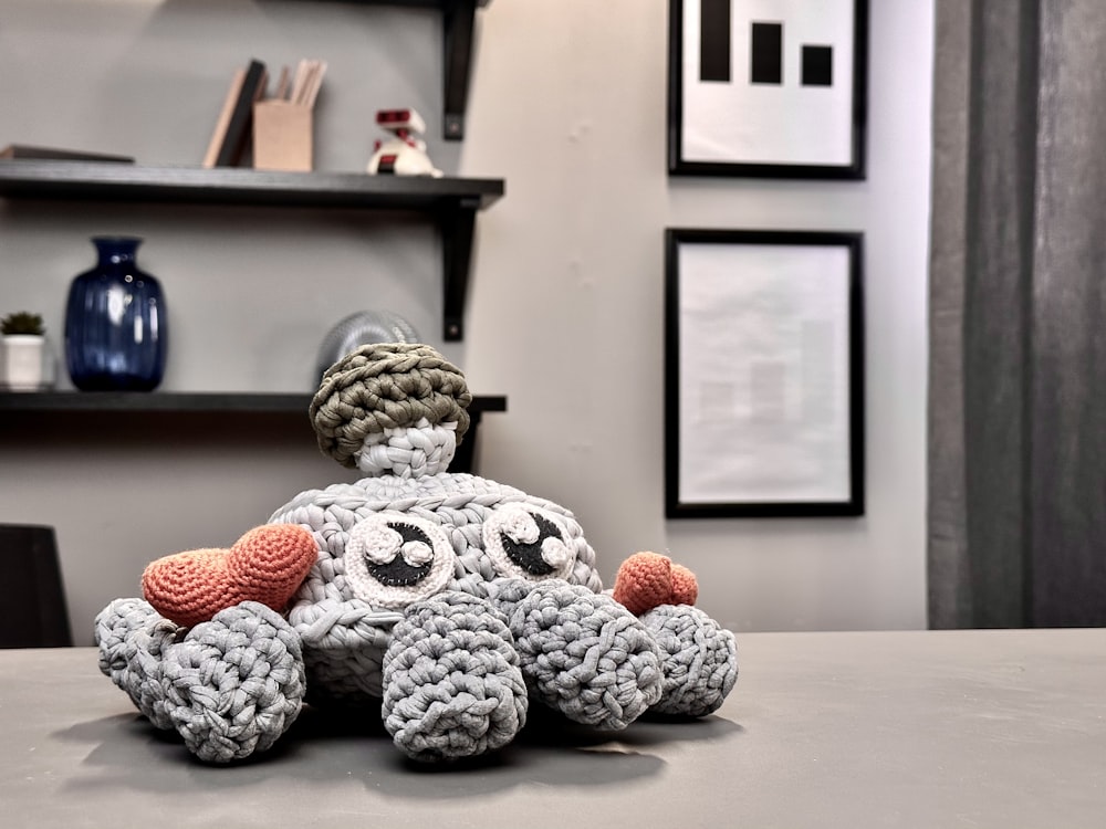 a crocheted stuffed animal sitting on top of a table