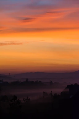 A serene twilight landscape with soft earthy tones and a glowing sunset sky over Australian wilderness.