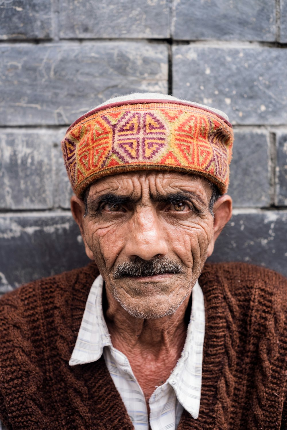 an old man with a hat on his head