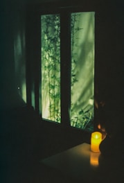 A serene room softly lit with candles and gentle natural elements.