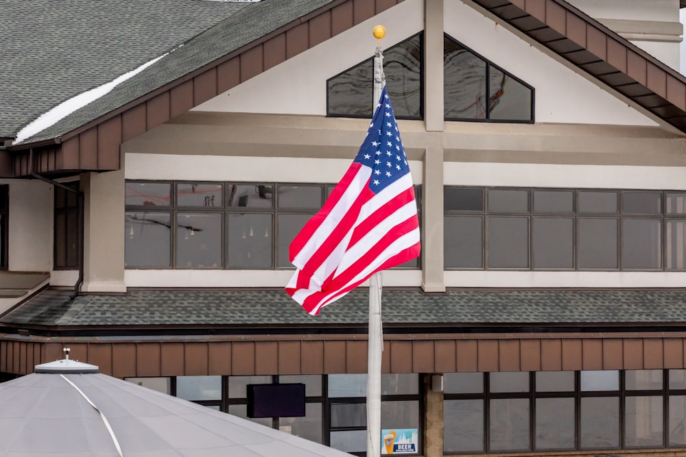 an american flag flying in front of a building