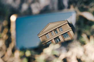 a reflection of a building in a mirror