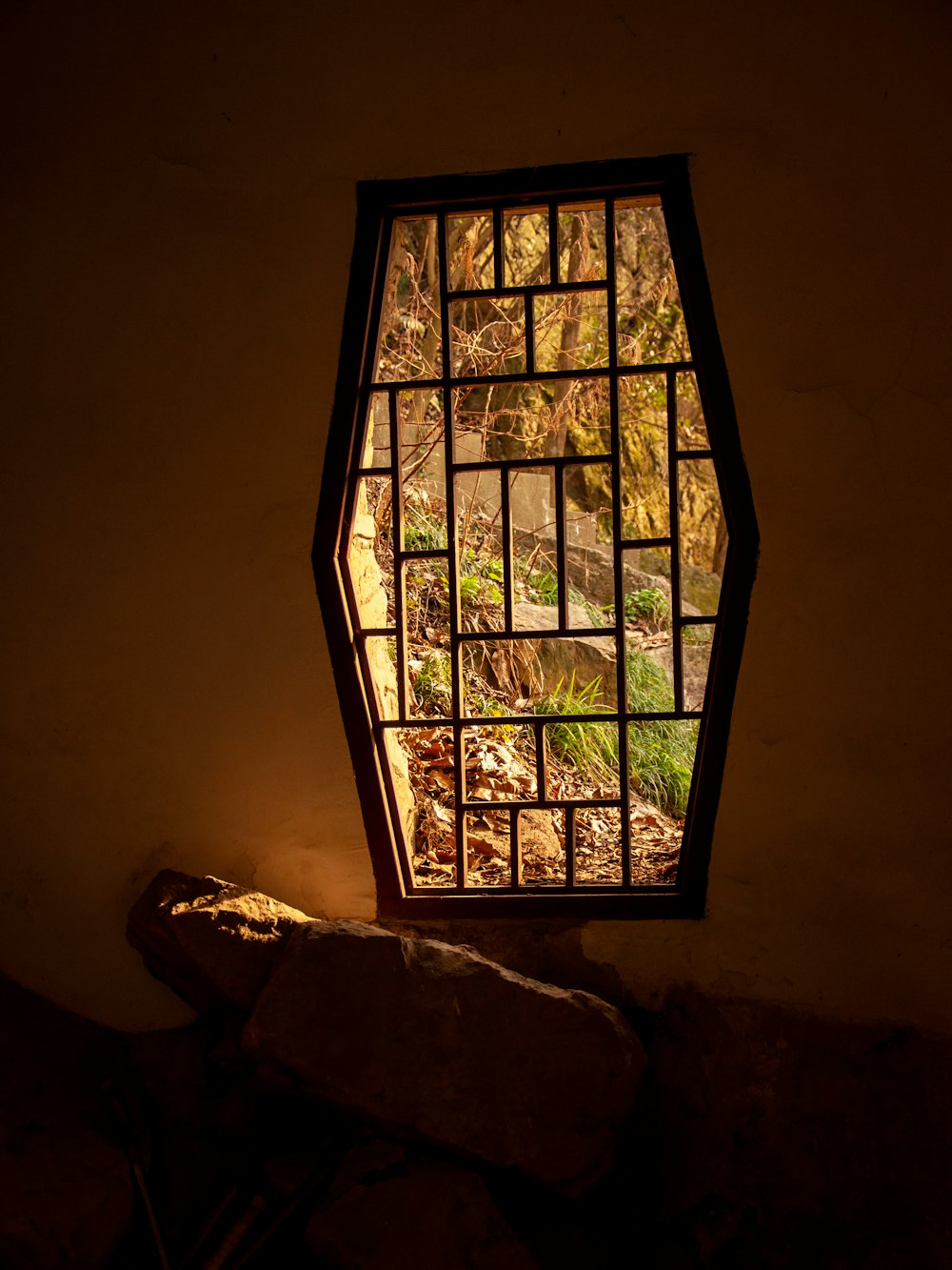 a stained glass window in the corner of a room