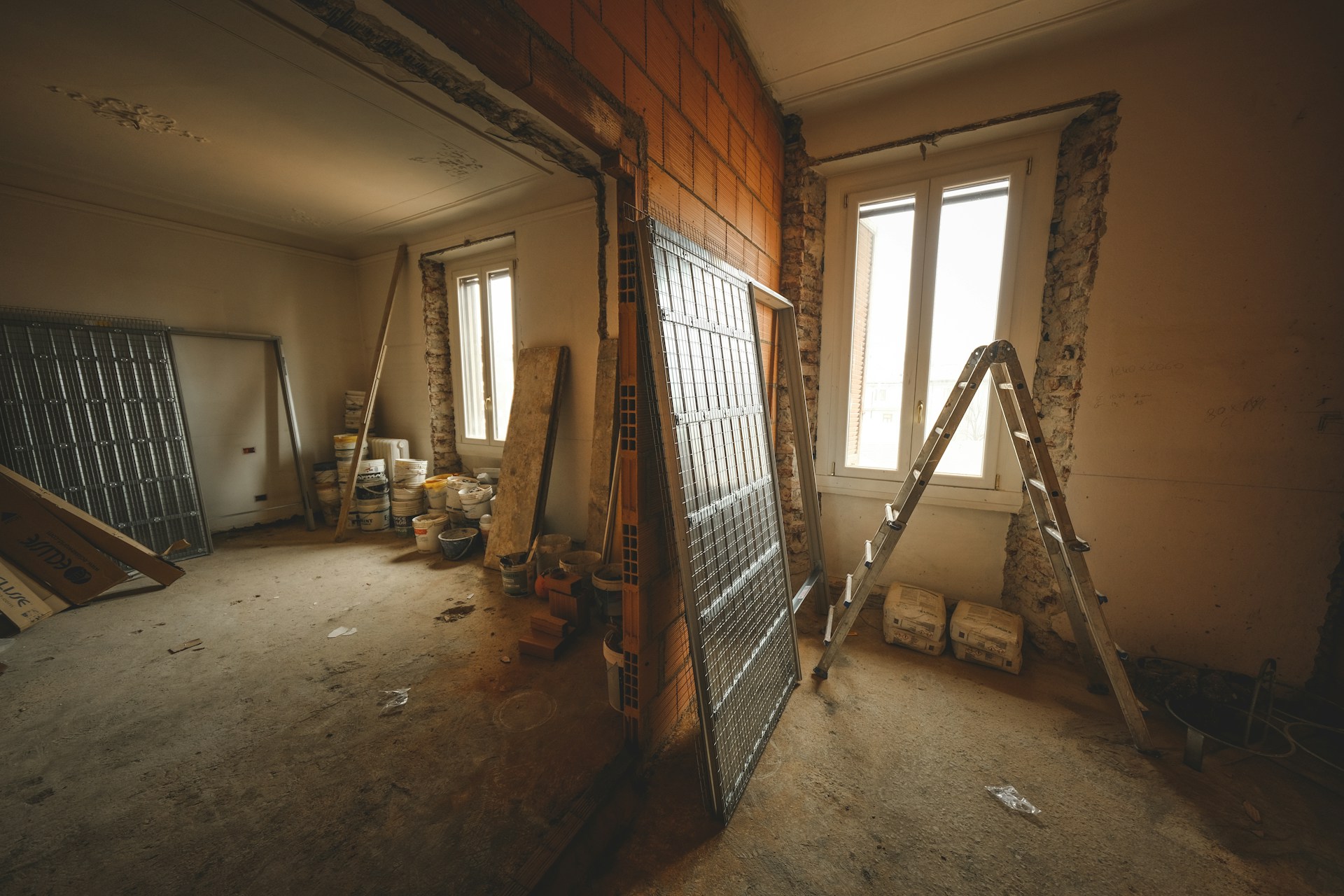 a room with a ladder and a window in it