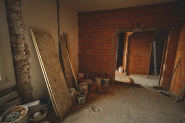 Image of an interior renovation showing fresh paint and new flooring.
