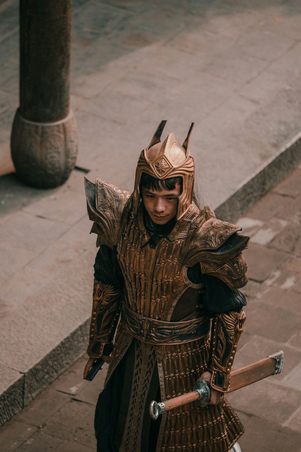 a man in a costume walking down a street