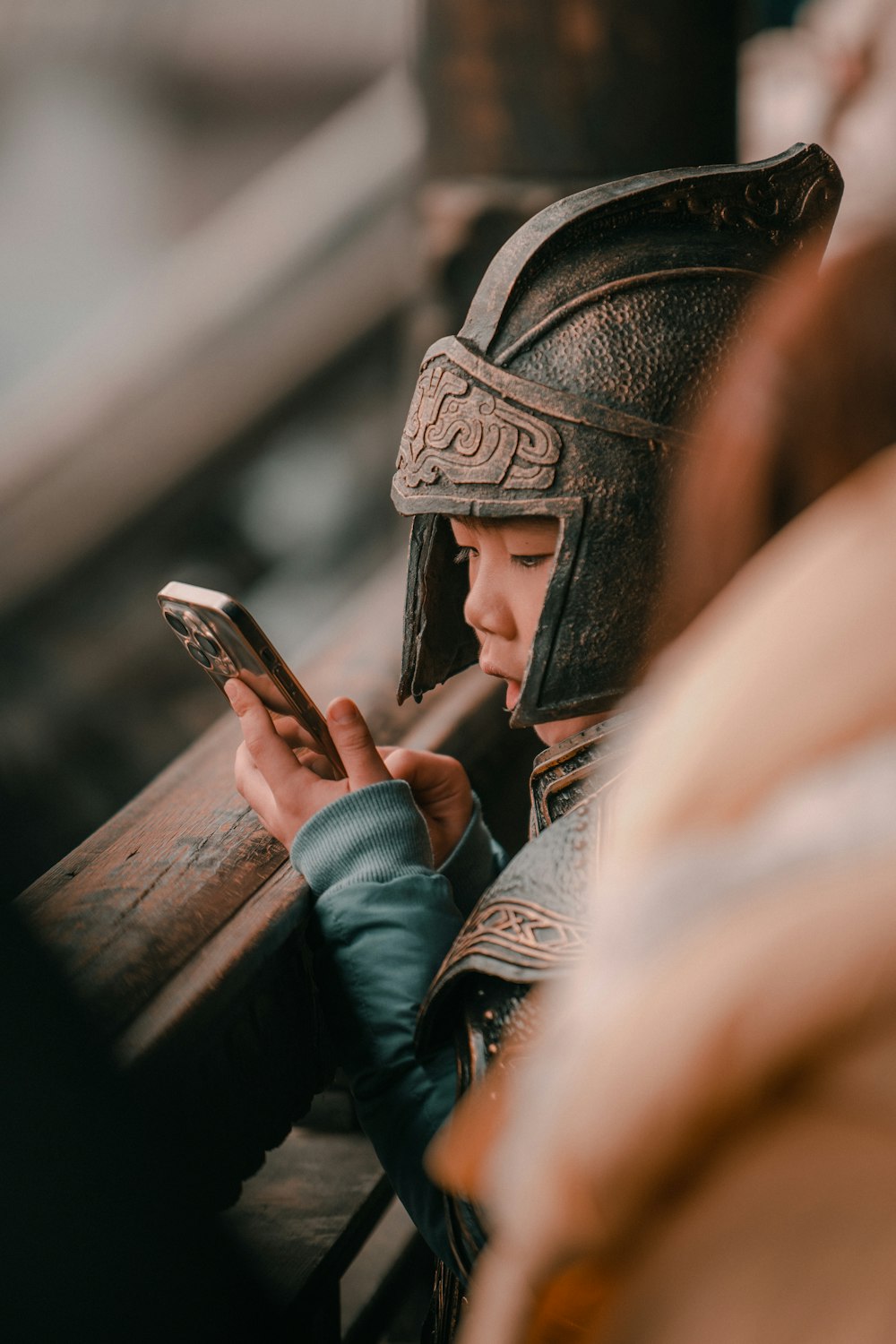 a person in a helmet looking at a cell phone