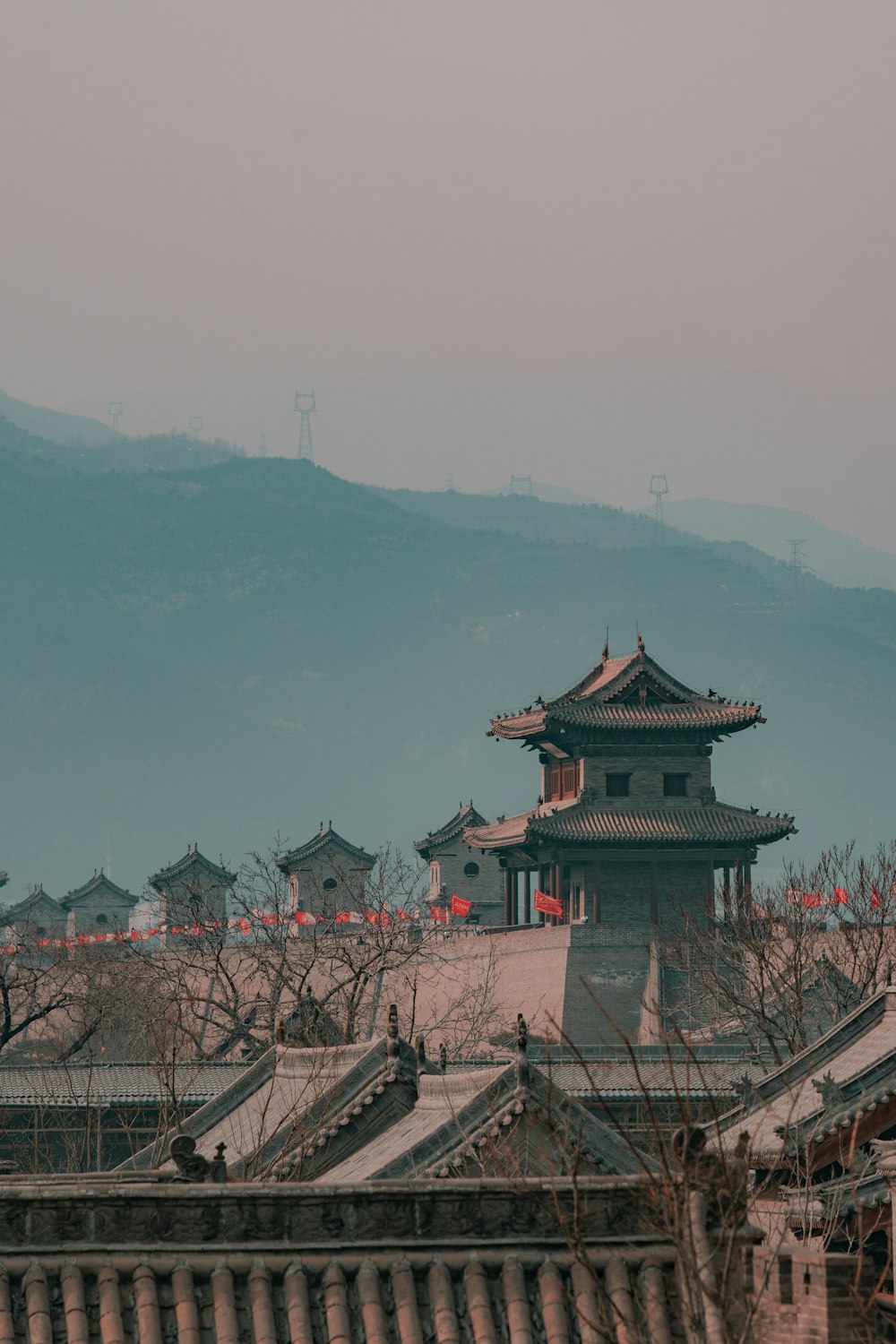 a view of a building with a mountain in the background