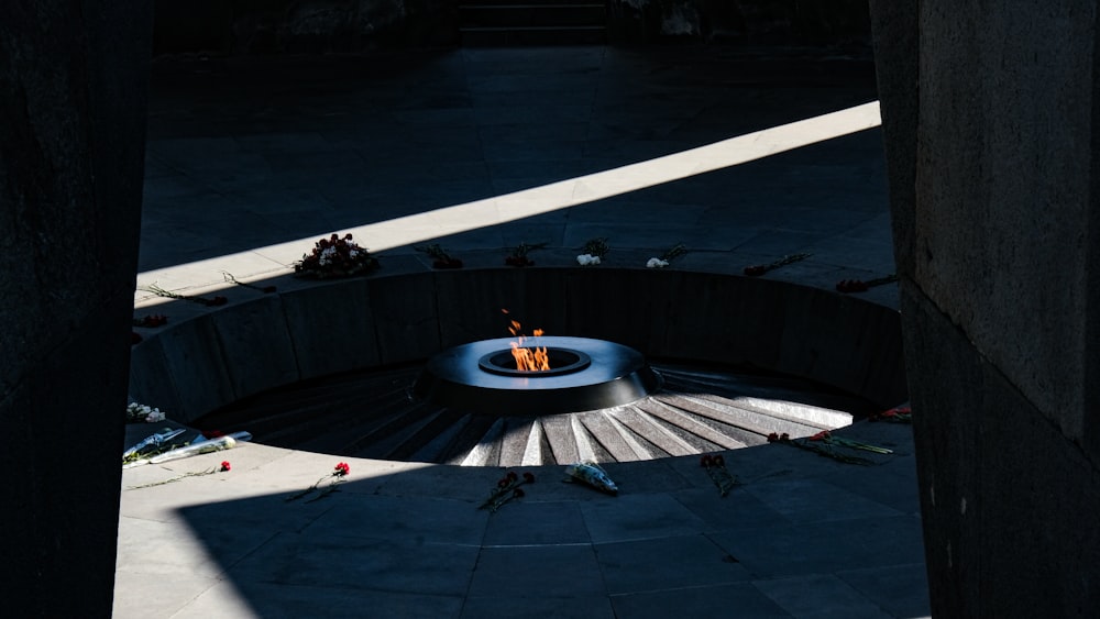 a fire pit sitting in the middle of a walkway