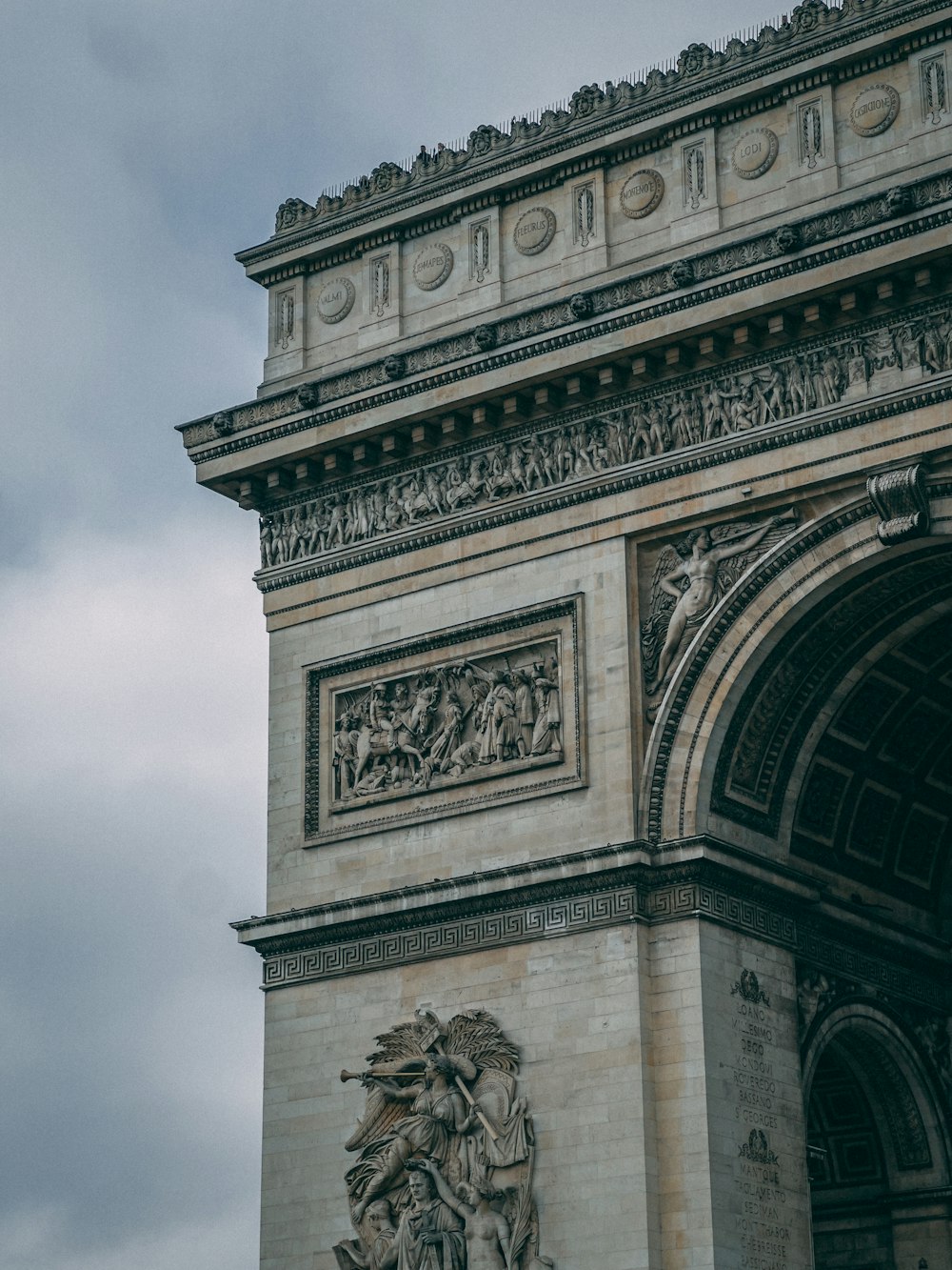 a very tall tower with a clock on it's side