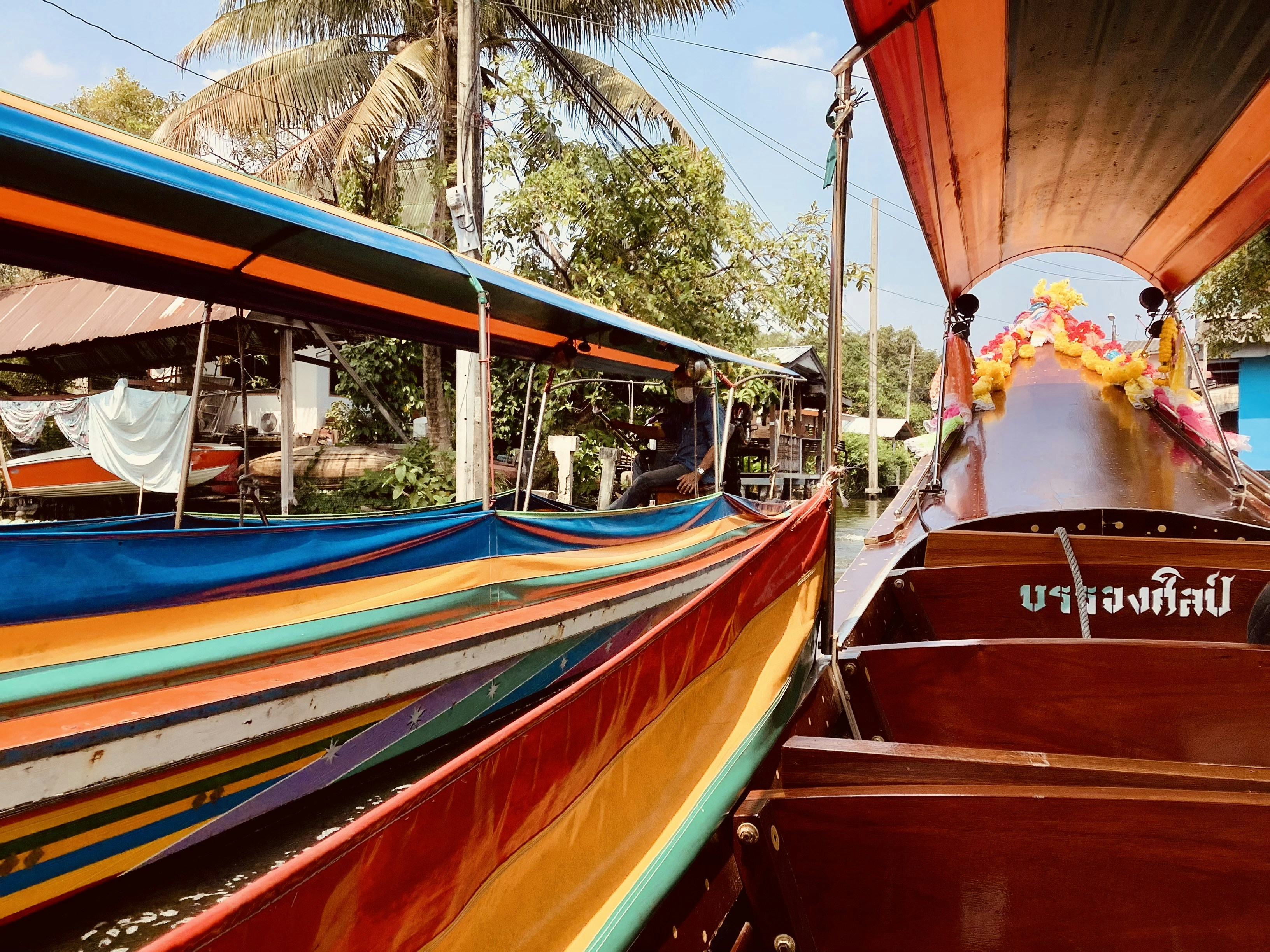 a colorful boat is docked in the water
