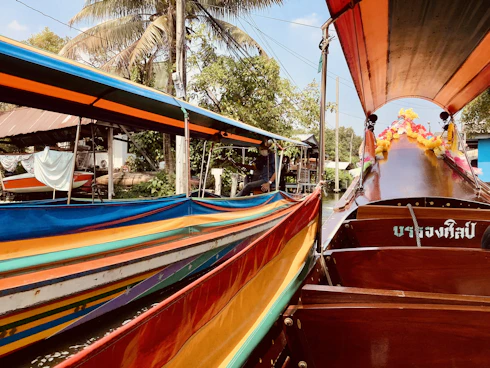 a colorful boat is docked in the water