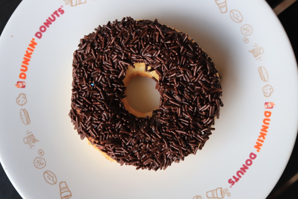 a donut with chocolate sprinkles on a plate