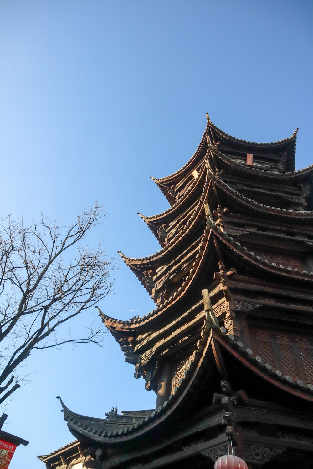 a tall building sitting next to a tree