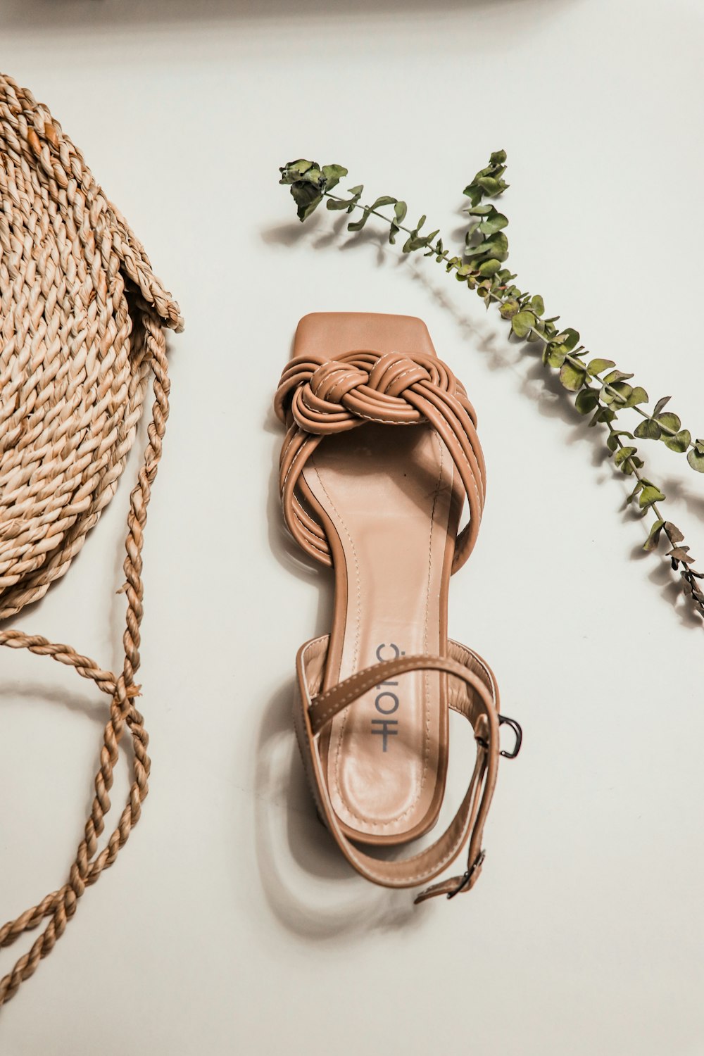 a pair of shoes sitting on top of a white table