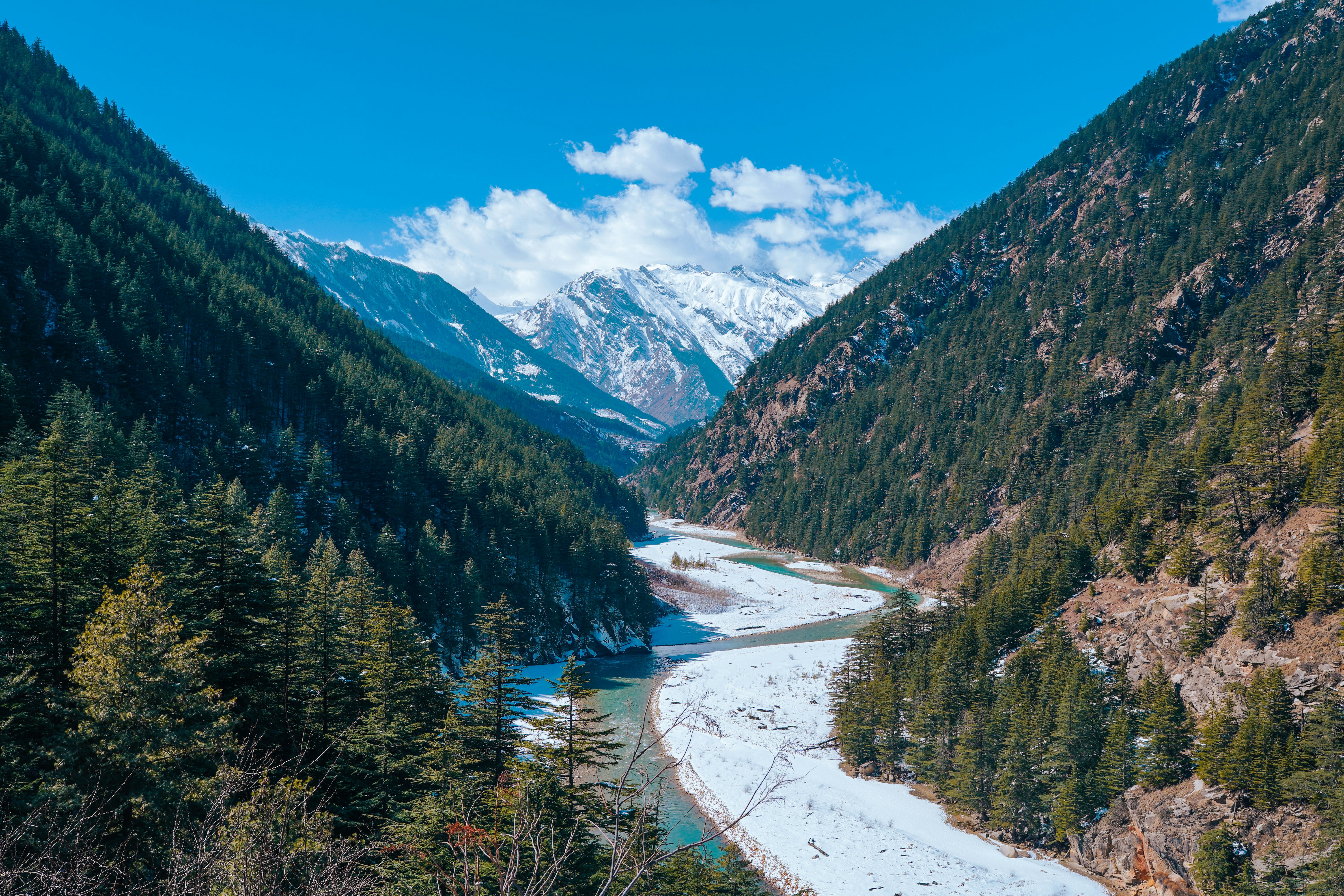 a view of a river in the middle of a mountain range