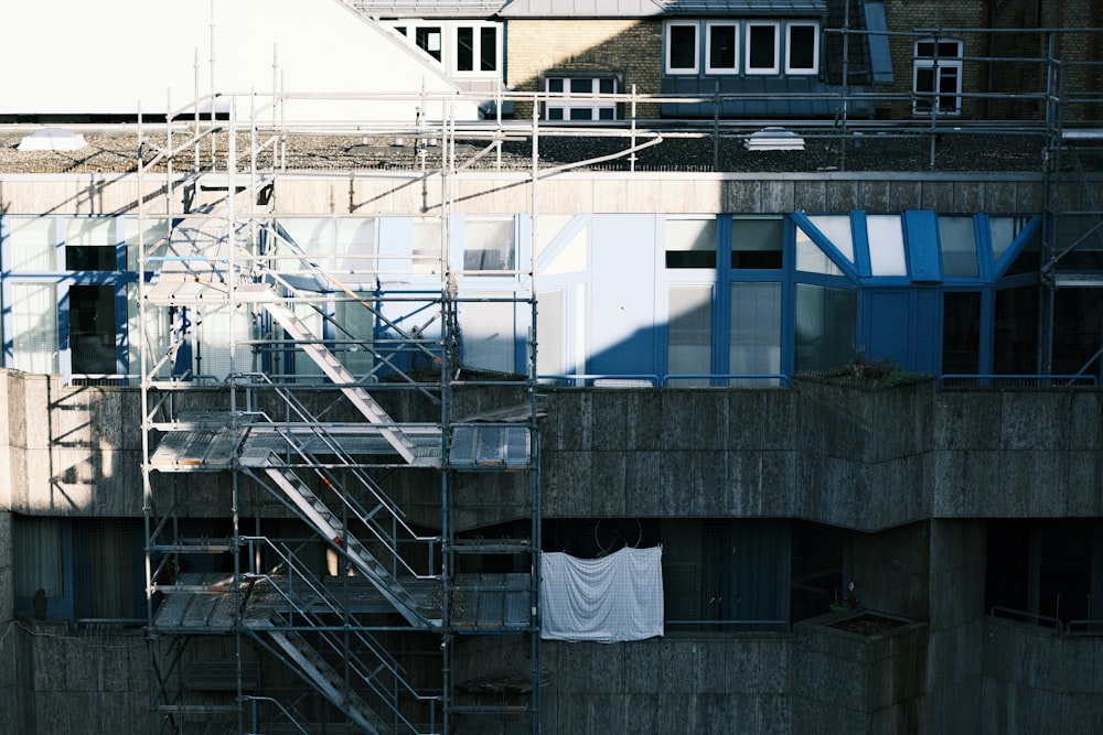 a building with a bunch of windows and a fire escape