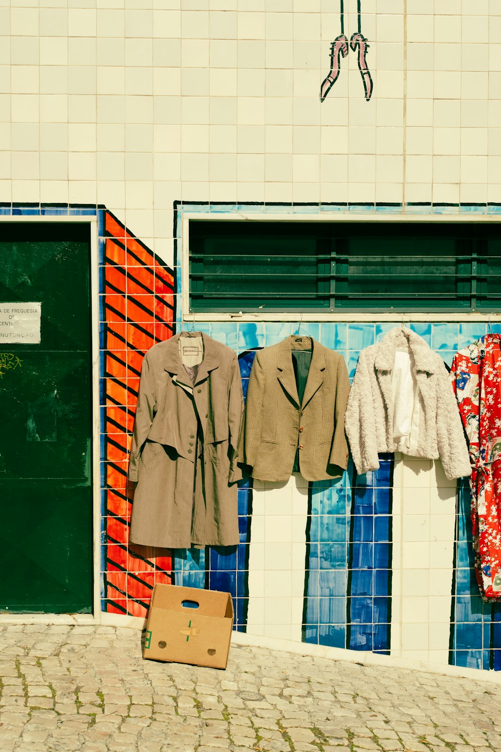 clothes hanging on a clothes line outside of a building