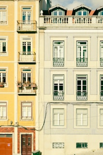 a tall building with many windows and balconies