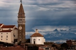 a tall clock tower towering over a city