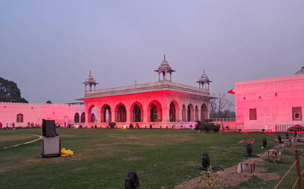 a large building with a red light on top of it