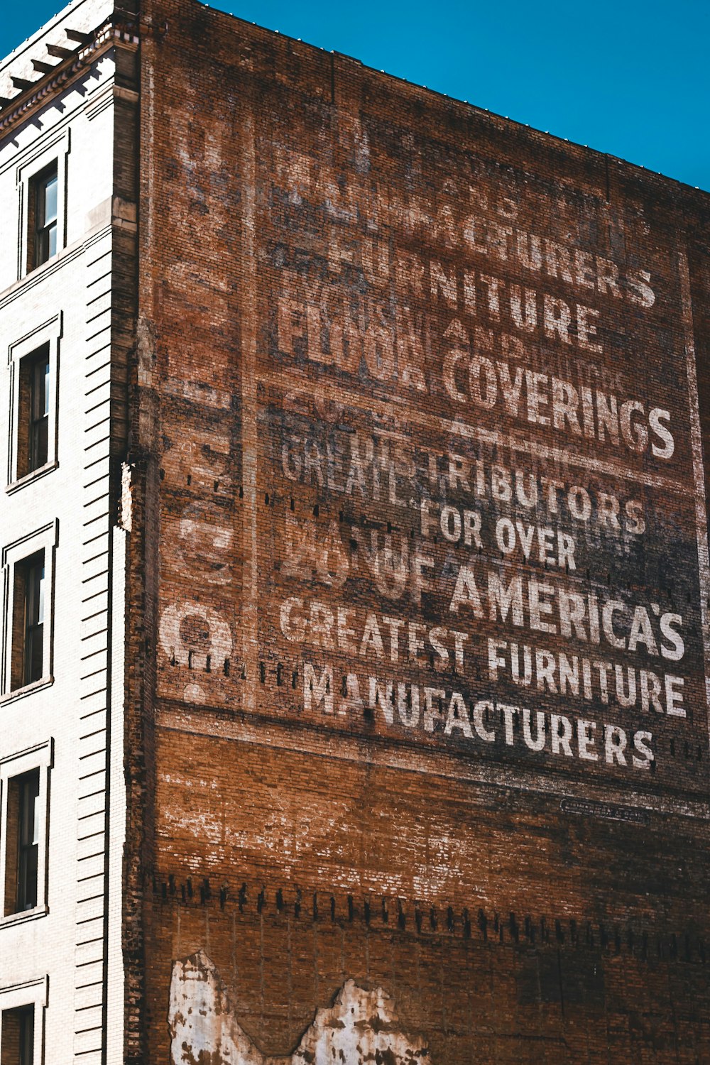 an old sign on the side of a building