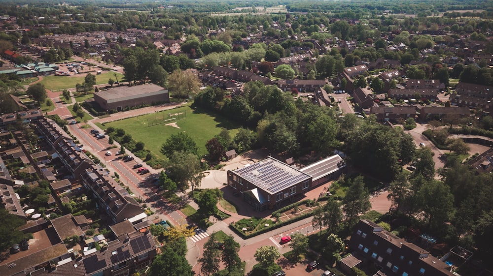 an aerial view of a building surrounded by trees