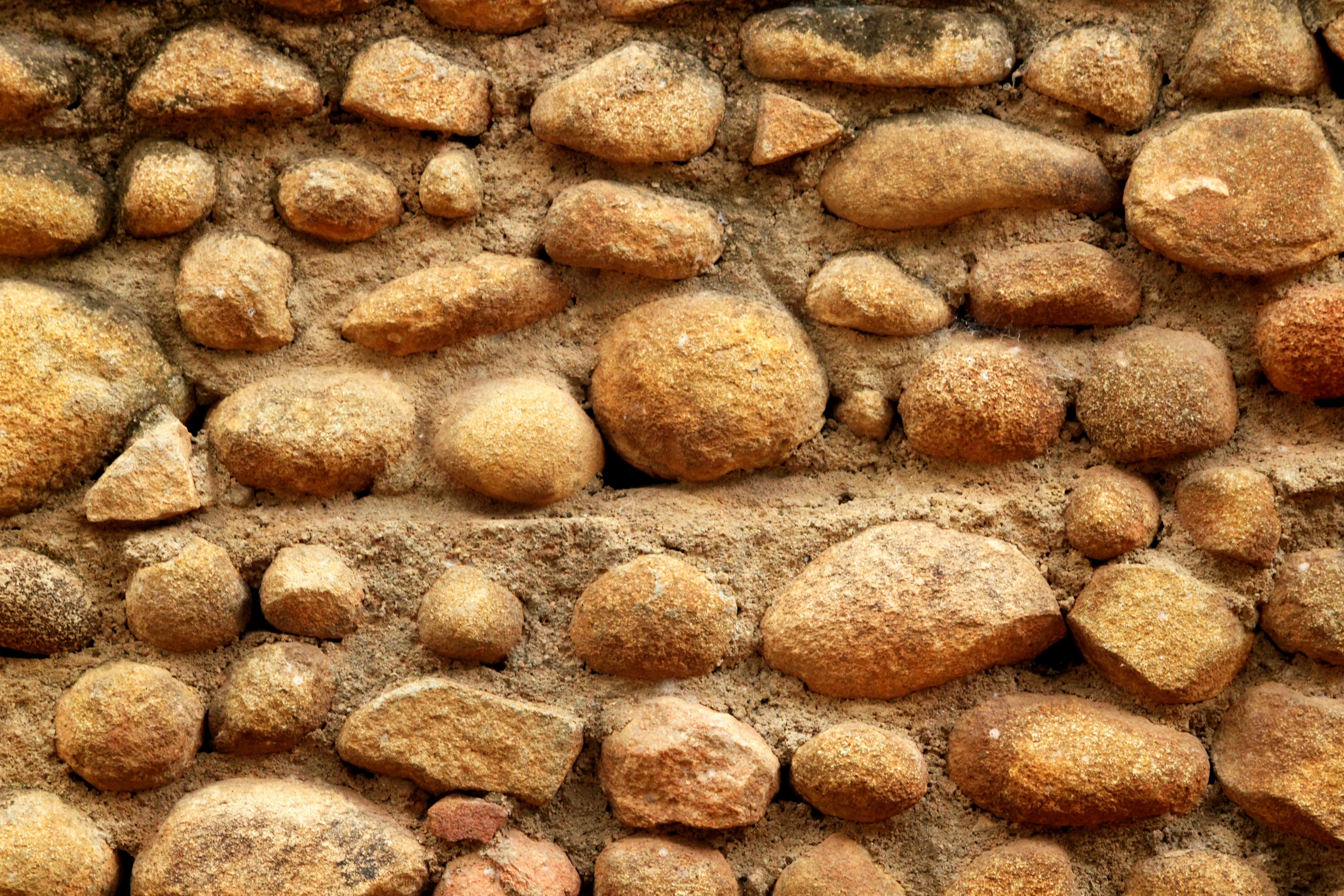 a close up of a wall made of rocks