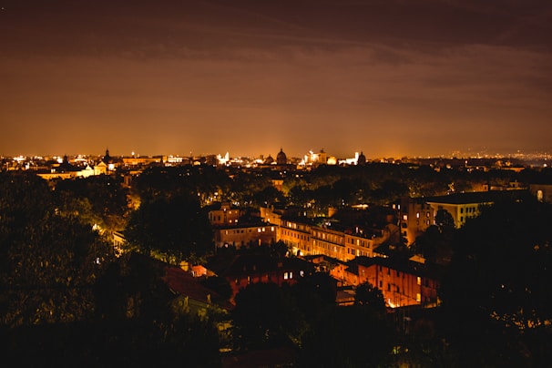 A warm, inviting cityscape of Kolkata at night with soft glowing lights.
