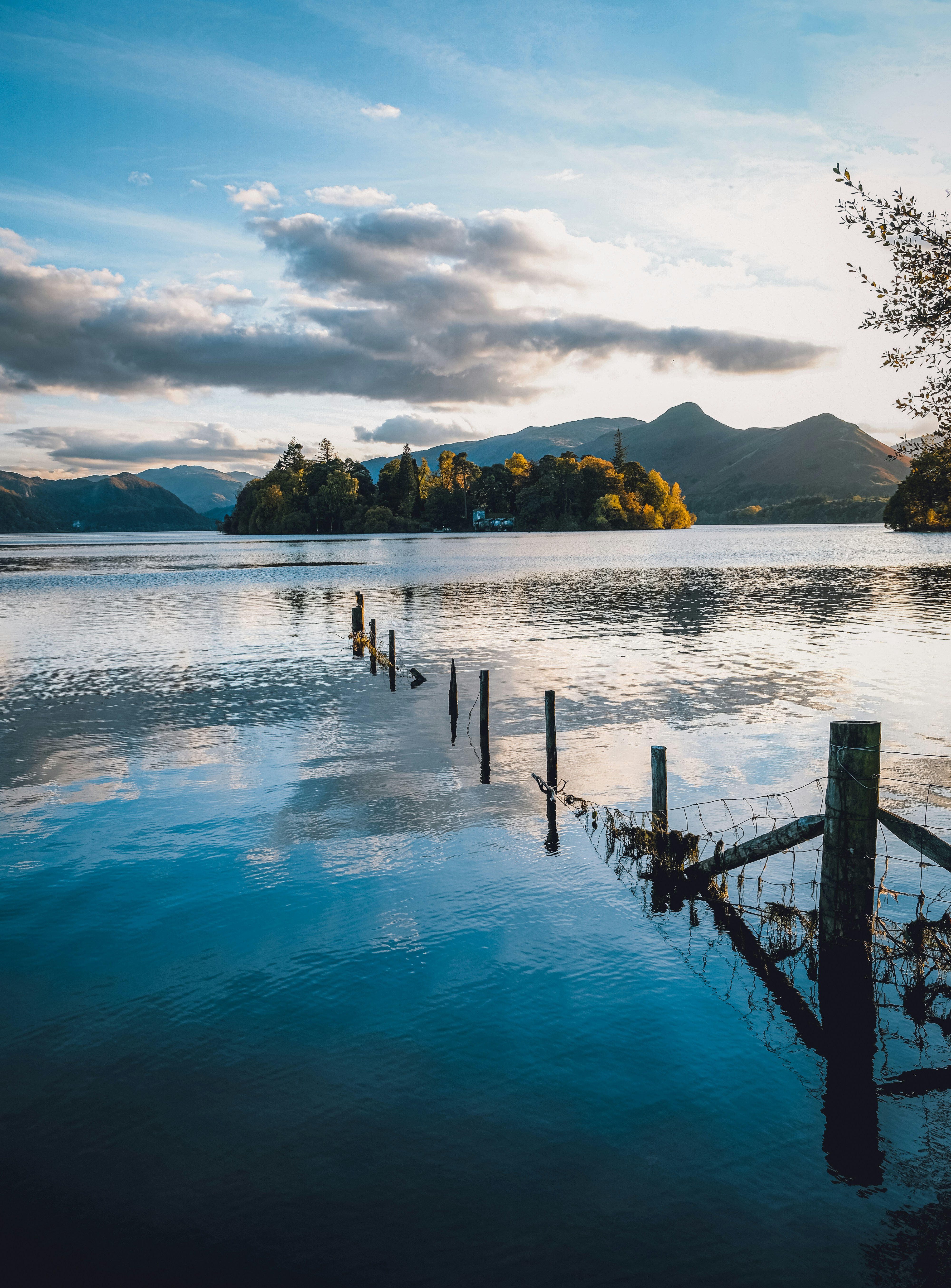 a body of water with a fence in the middle of it