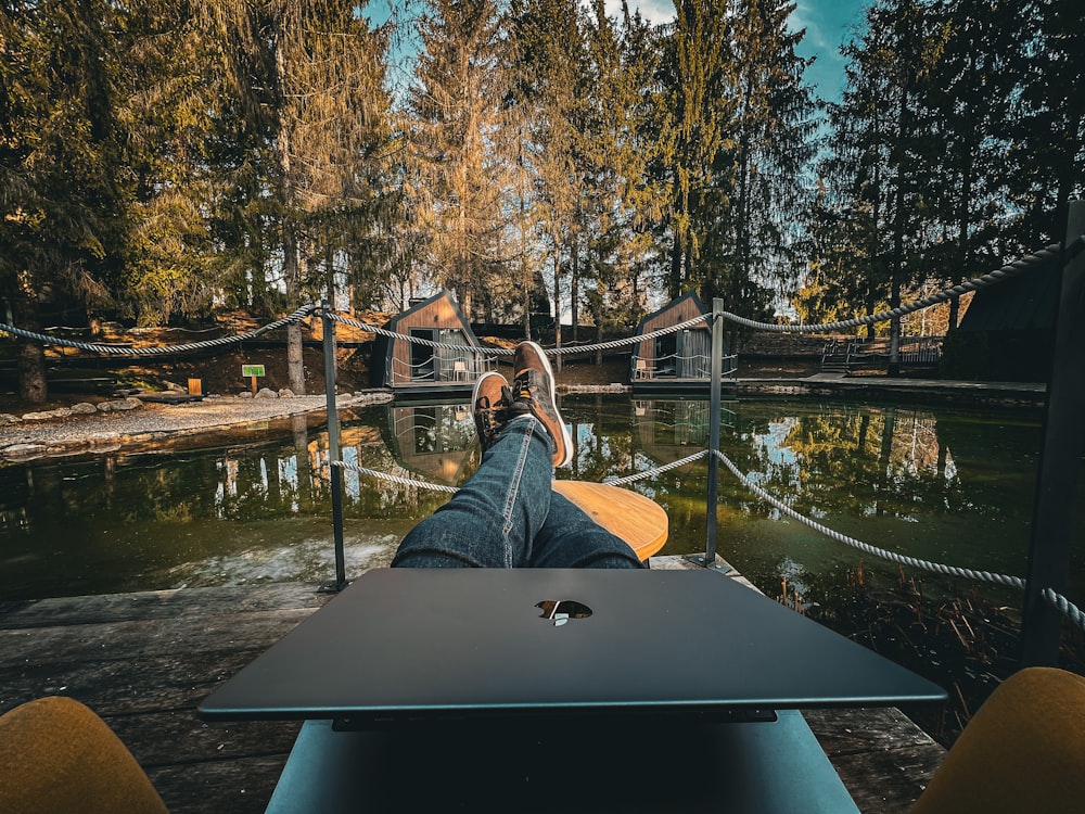 a person laying on a boat in the water