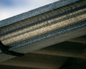 a close up view of a metal gutter