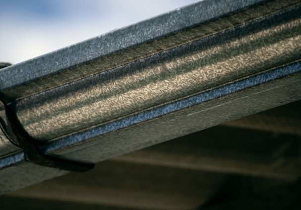 a close up view of a metal gutter