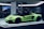 A sleek, lime green sports car is displayed in a well-lit showroom. The car's doors are open, showcasing its luxurious interior. In the background, other high-performance vehicles are partially visible, creating an atmosphere of elegance and sophistication.