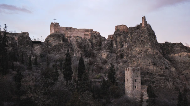 Ruins of a crusader castle overlooking a rugged landscape in the Holy Land.