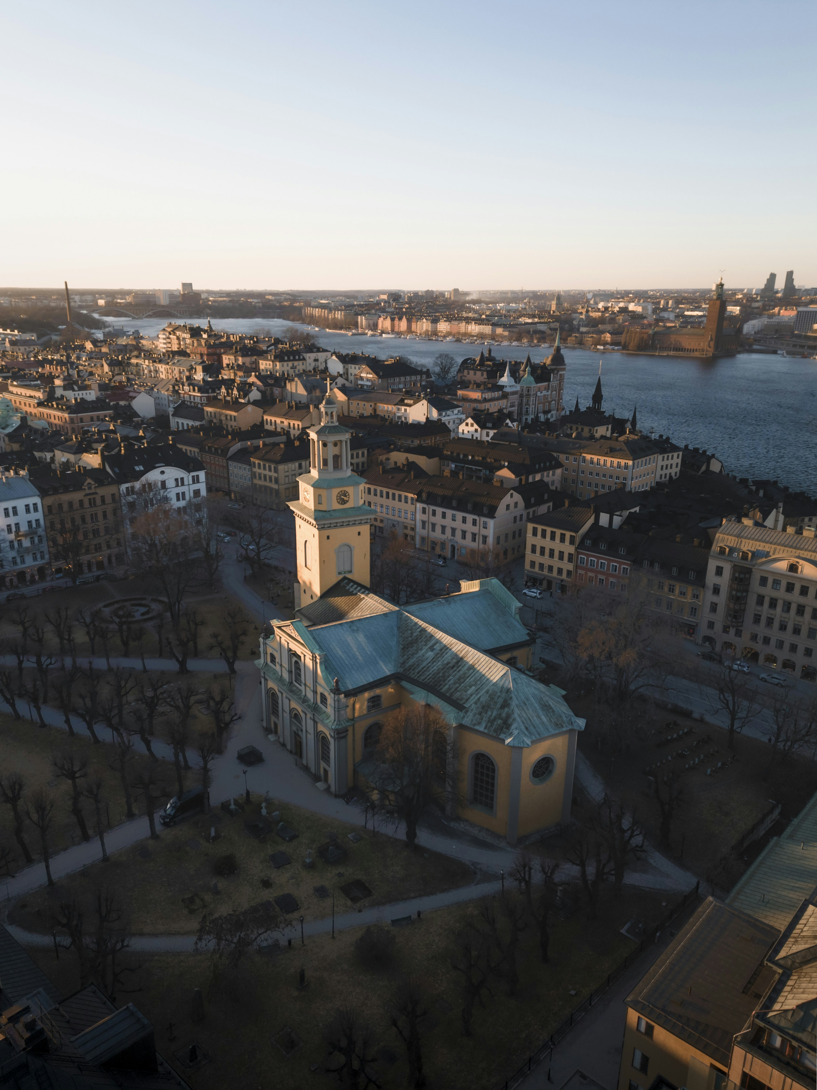 an aerial view of a city with a river in the background