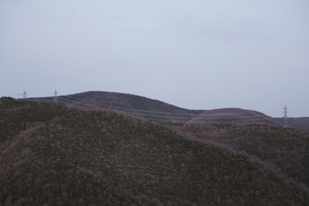 a hill with a wire fence on top of it