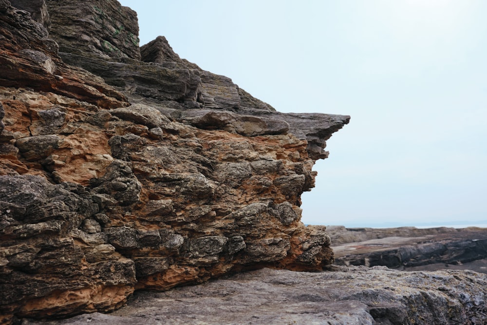 a rock formation with a sky in the background