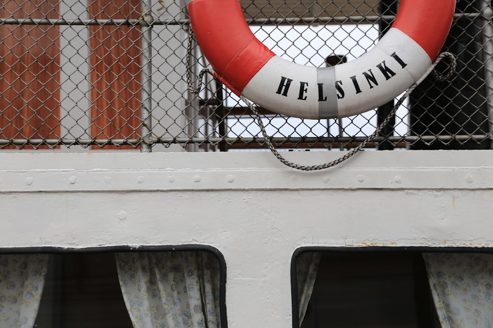 a life preserver hanging on the side of a building