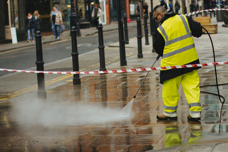 Pressure washer in use on an exterior surface