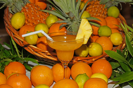 Close-up of a tropical drink with exotic fruits and a bright, refreshing presentation.