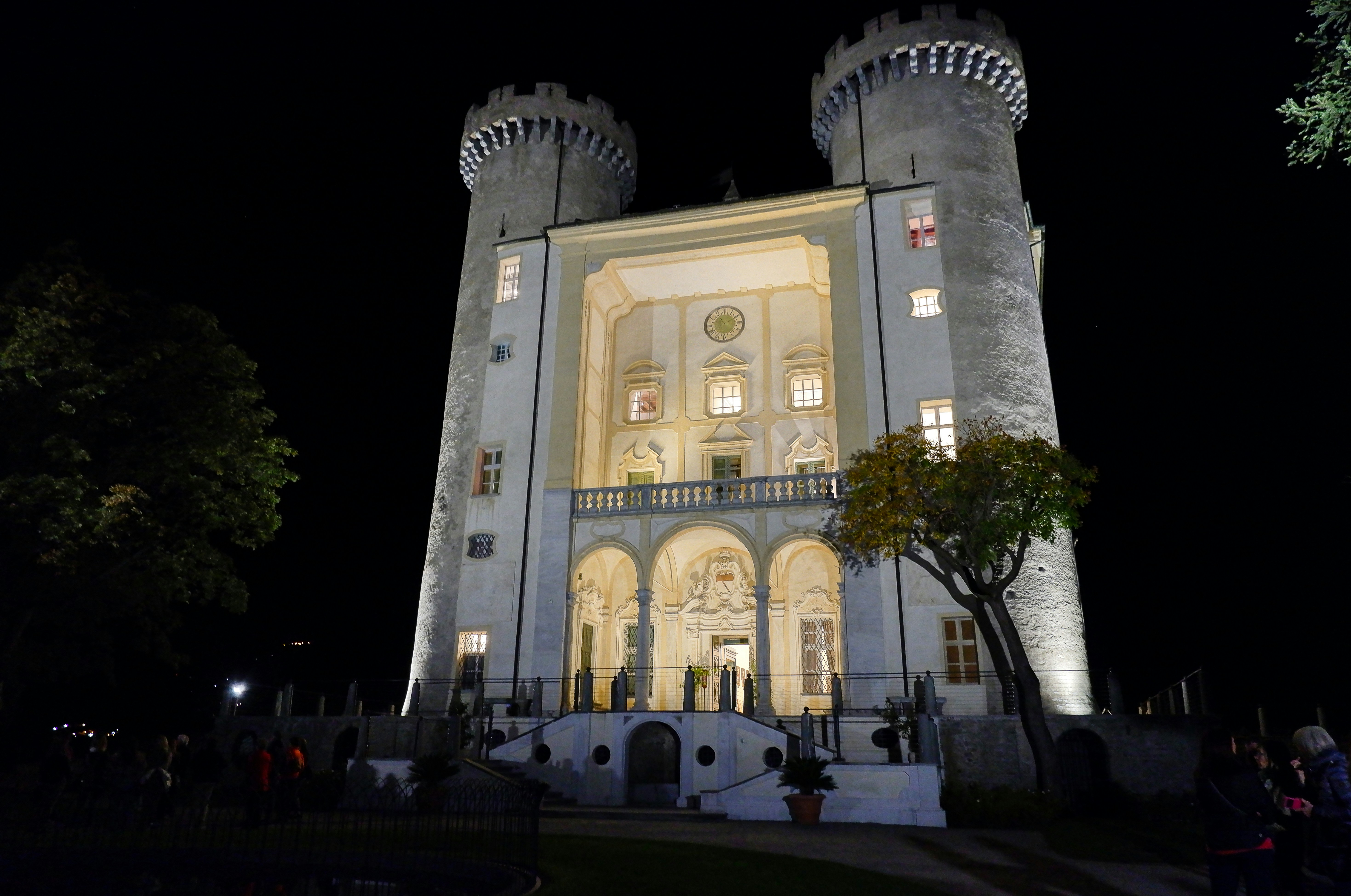 a castle like building lit up at night