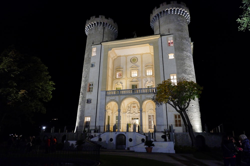 a castle like building lit up at night