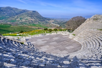 a stone amphit with a view of a valley