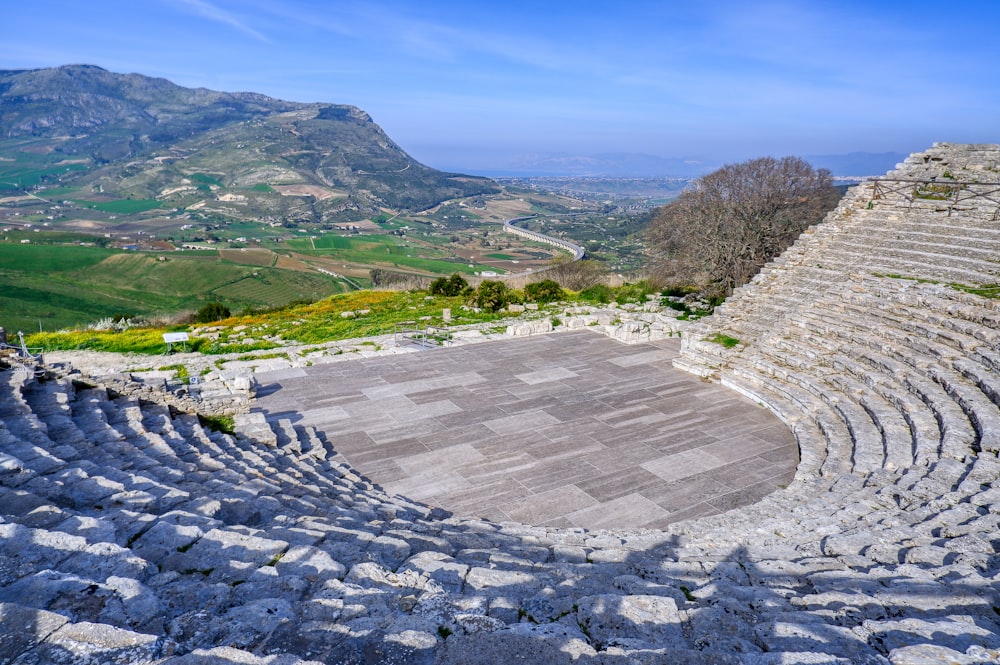 a stone amphit with a view of a valley